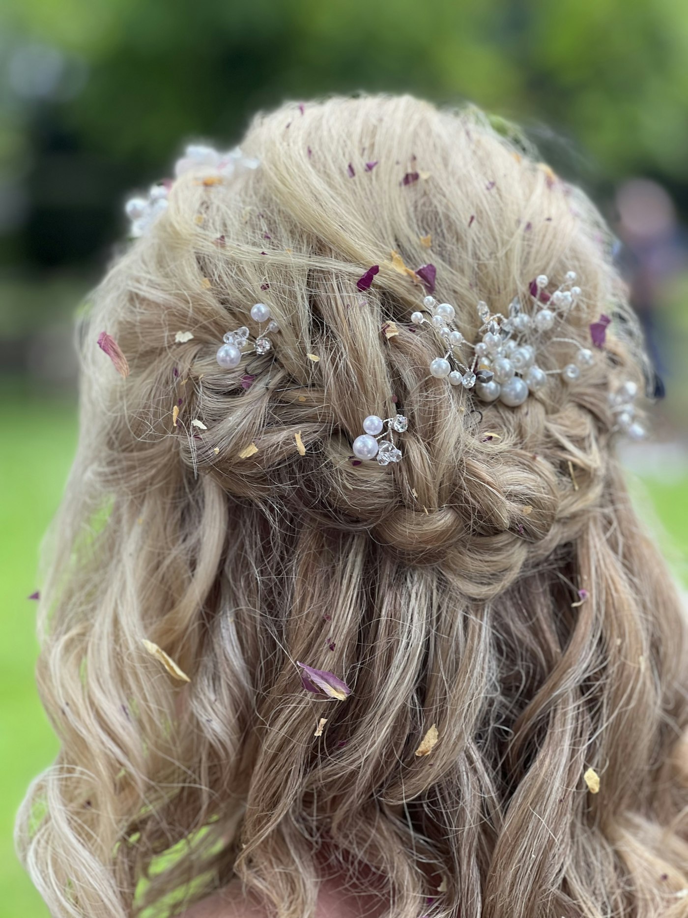 Bride with soft styled hair and floral details